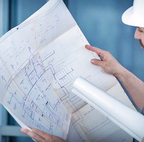 Architect builder studying layout plan of the rooms